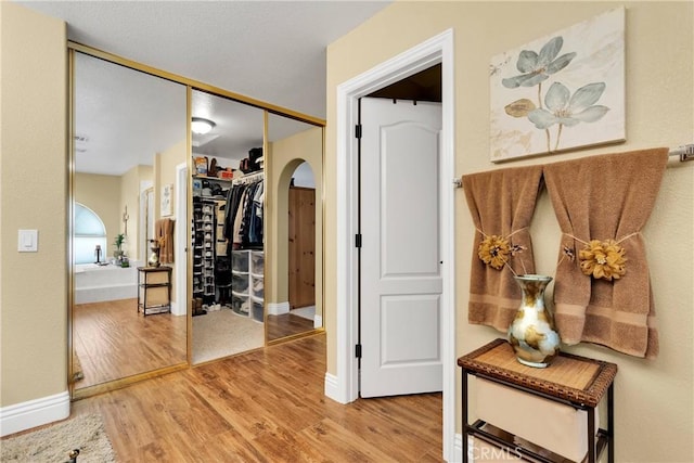 hallway featuring hardwood / wood-style floors