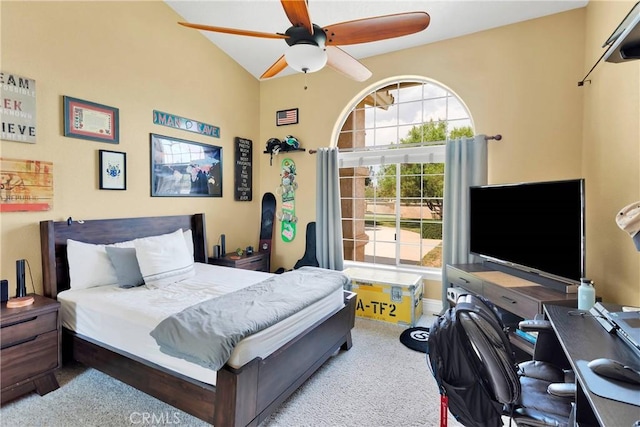 carpeted bedroom featuring ceiling fan and vaulted ceiling