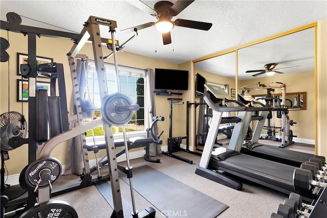 exercise room featuring ceiling fan, plenty of natural light, and a textured ceiling