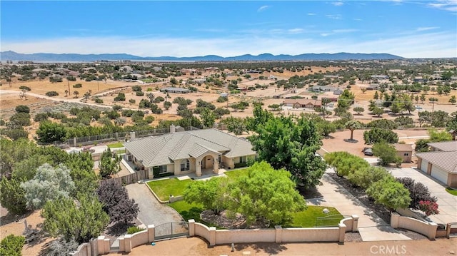 birds eye view of property featuring a mountain view