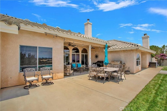 view of patio / terrace with grilling area and ceiling fan