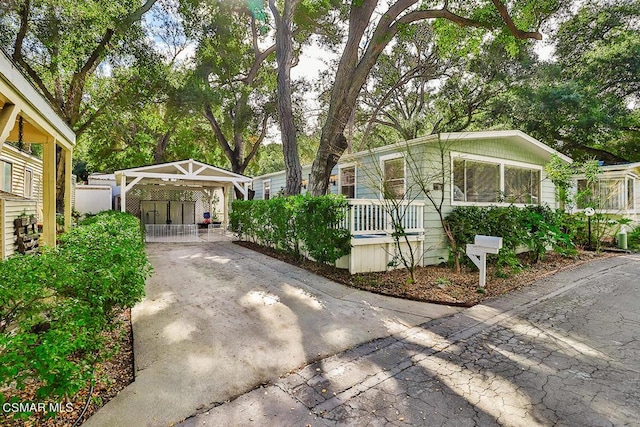 view of front of home with a carport