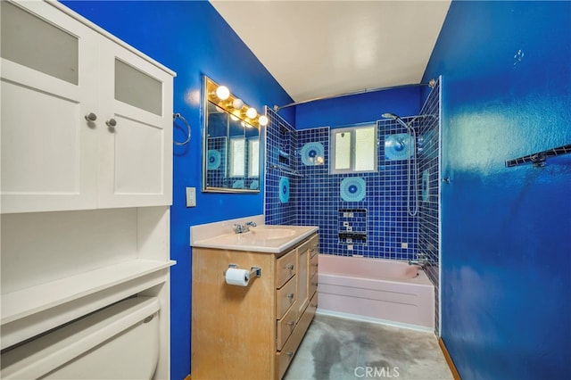 bathroom featuring vanity and tiled shower / bath combo