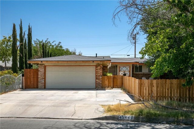 ranch-style home featuring a garage