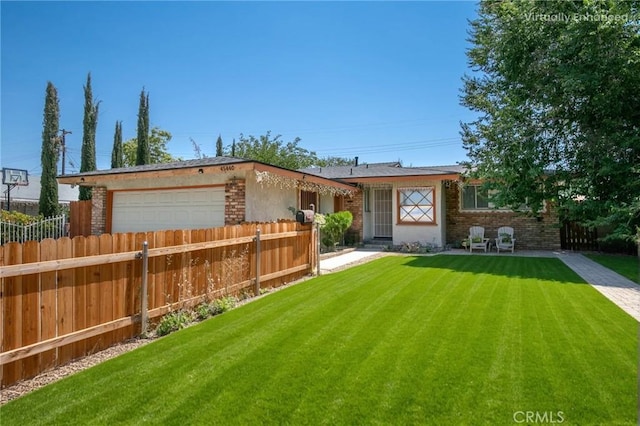 ranch-style home featuring a garage and a front yard