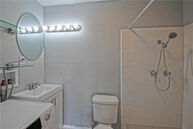 1108 Camino Real Unit 510, Redondo Beach, CA 90277 - full bath with washer / clothes dryer, tiled shower, vanity, and toilet