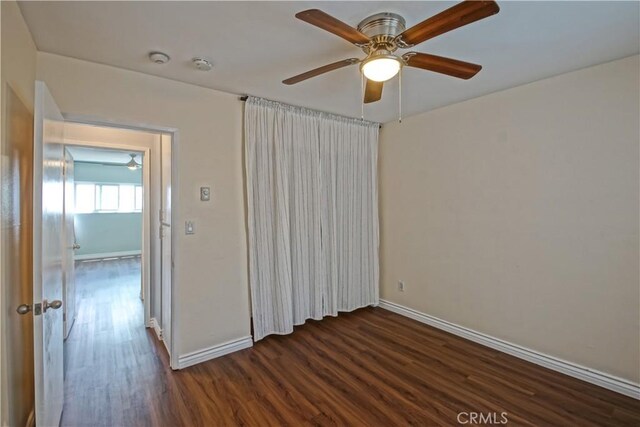 1108 Camino Real Unit 510, Redondo Beach, CA 90277 - empty room featuring dark wood-style floors, baseboards, and ceiling fan