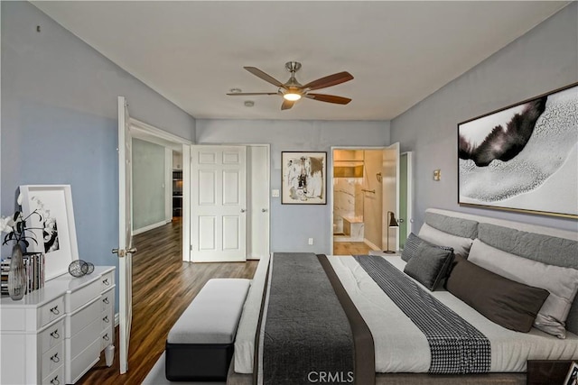 bedroom featuring dark hardwood / wood-style floors, ensuite bath, and ceiling fan