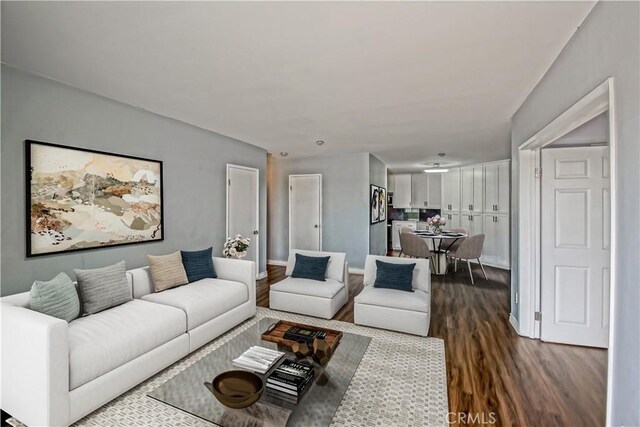 1108 Camino Real Unit 510, Redondo Beach, CA 90277 - living area with dark wood-style floors and baseboards