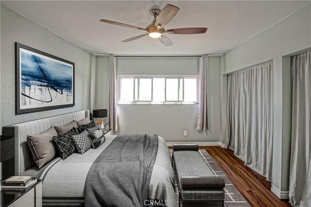1108 Camino Real Unit 510, Redondo Beach, CA 90277 - bedroom with dark wood-style floors and a ceiling fan