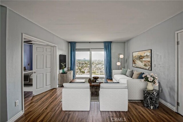 1108 Camino Real Unit 510, Redondo Beach, CA 90277 - living area featuring dark wood-style floors and baseboards