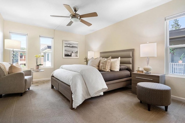 bedroom featuring ceiling fan and light carpet