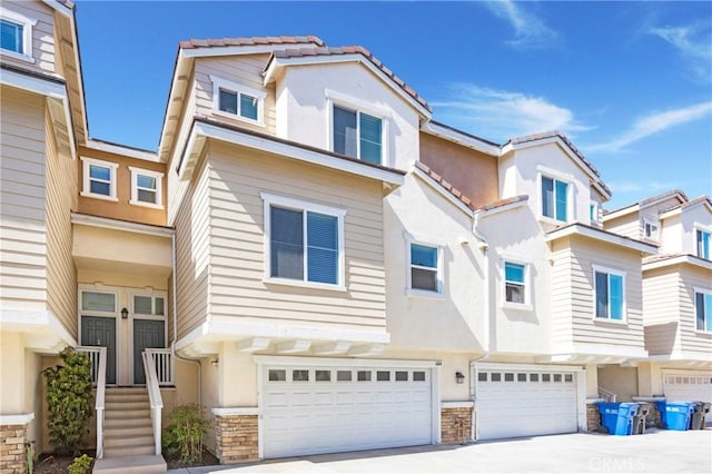 townhome / multi-family property featuring a garage