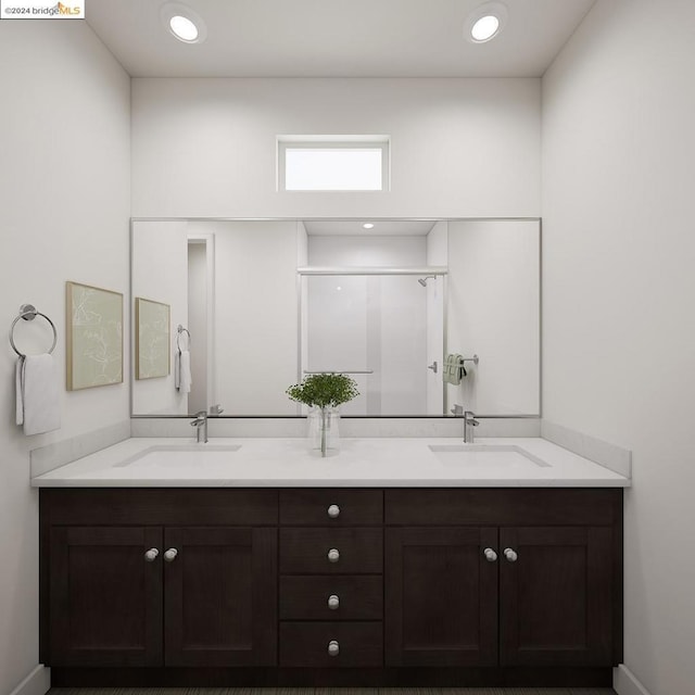 bathroom featuring vanity and an enclosed shower