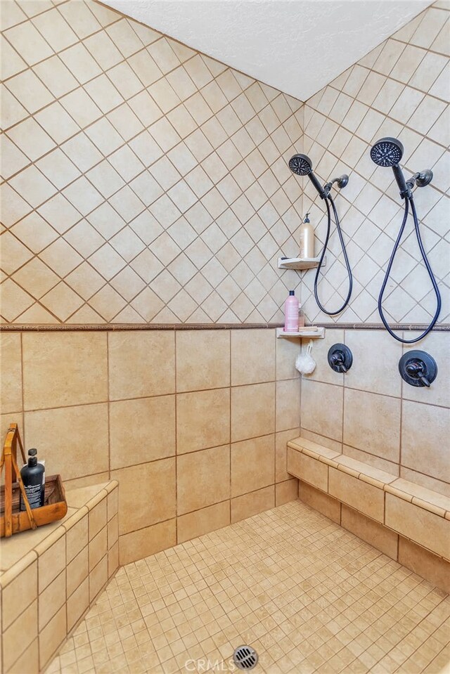 bathroom with tiled shower