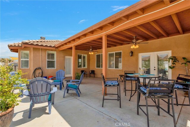 view of patio featuring ceiling fan