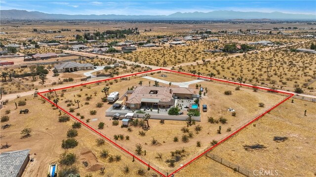 birds eye view of property featuring a mountain view