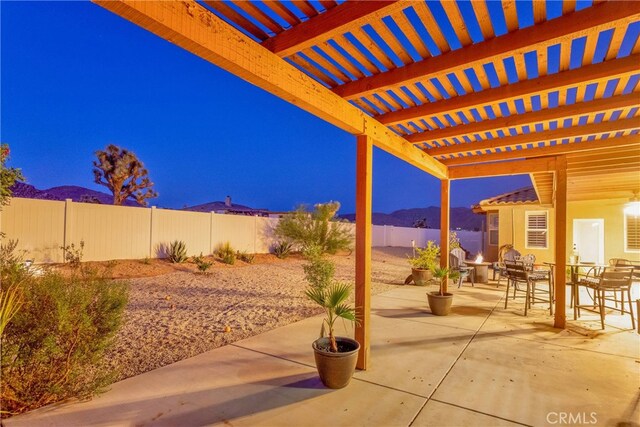 view of patio with a mountain view and a pergola