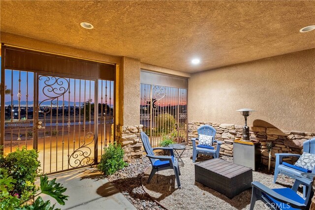 view of patio terrace at dusk