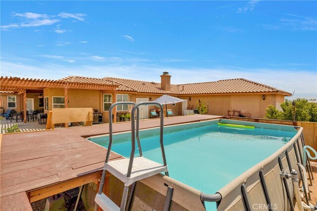 view of swimming pool with a pergola