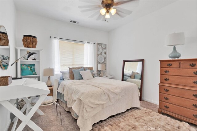 bedroom featuring ceiling fan and light colored carpet