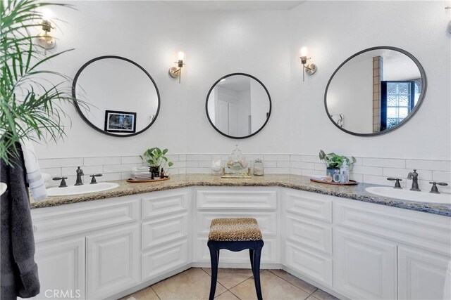 bathroom with vanity and tile patterned floors