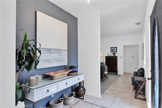 interior space with light tile patterned floors