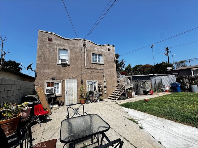 back of property featuring a patio and cooling unit