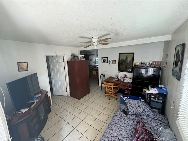 living room featuring light tile patterned flooring, a textured ceiling, and ceiling fan