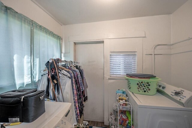 interior space with washing machine and clothes dryer and laundry area