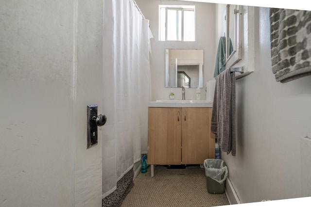 full bath with vanity and curtained shower