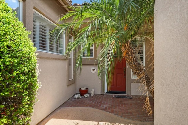 doorway to property featuring a patio