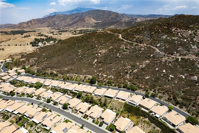 drone / aerial view featuring a residential view and a mountain view