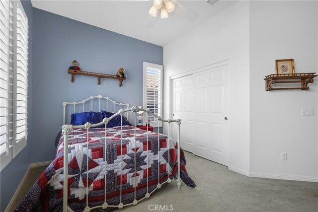 bedroom featuring a closet, carpet floors, and ceiling fan