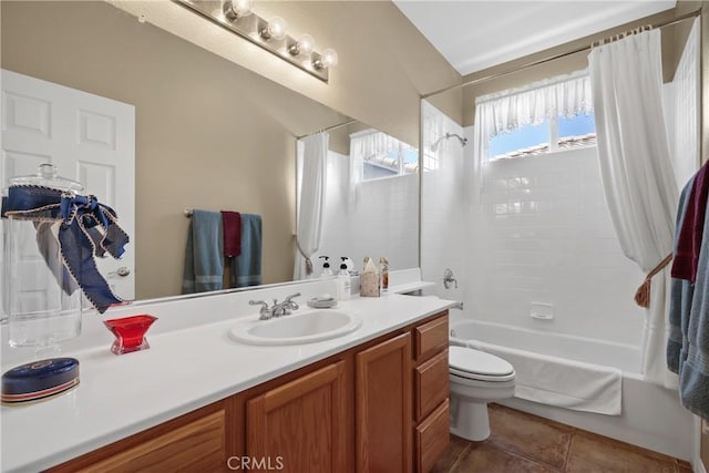 bathroom with shower / bath combination with curtain, tile patterned flooring, vanity, and toilet