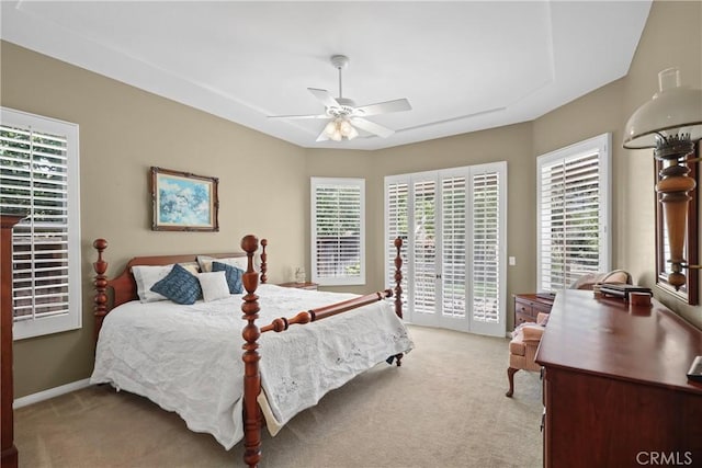 bedroom with a ceiling fan, access to outside, light colored carpet, and baseboards