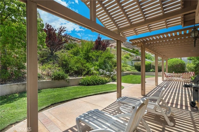 view of patio with fence and a pergola