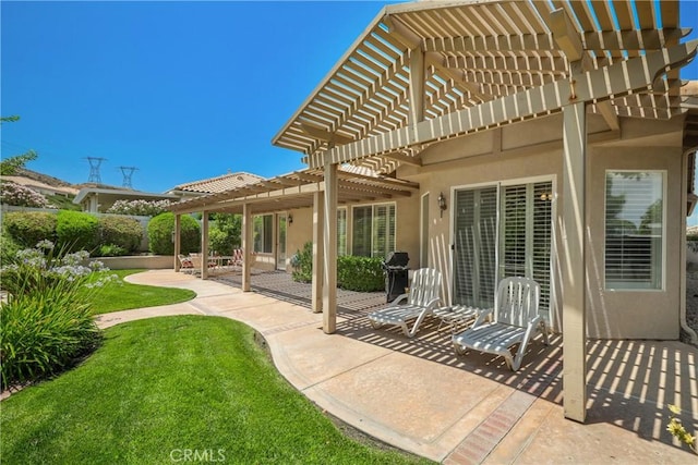 view of patio with a grill and a pergola