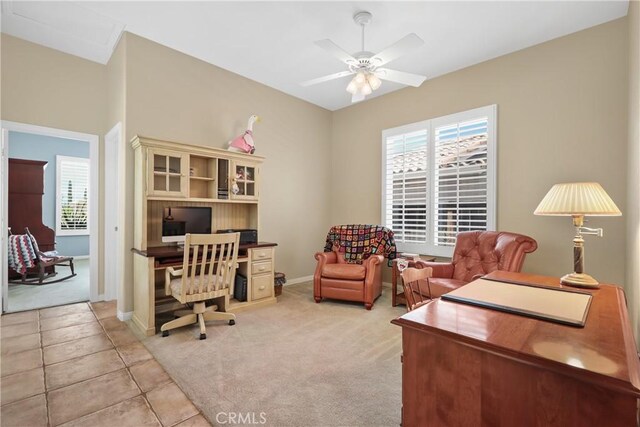 home office featuring ceiling fan and light tile patterned floors