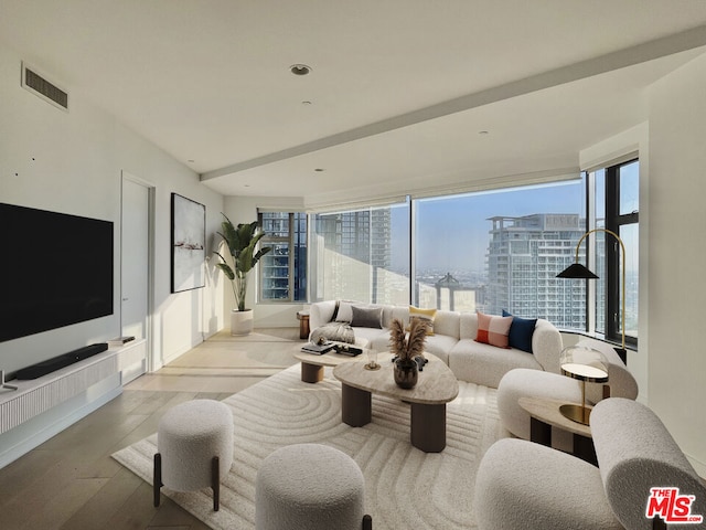 living room featuring plenty of natural light and light hardwood / wood-style floors