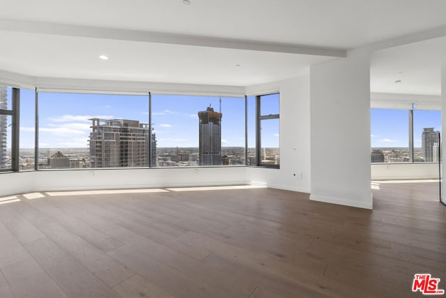 spare room featuring hardwood / wood-style floors