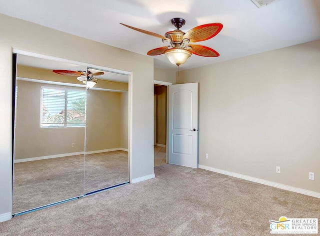 unfurnished bedroom featuring a closet, ceiling fan, and light carpet