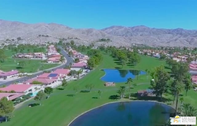 drone / aerial view with a water and mountain view