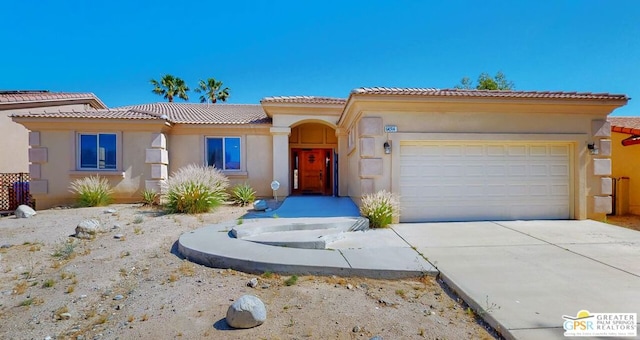 mediterranean / spanish-style house featuring a garage