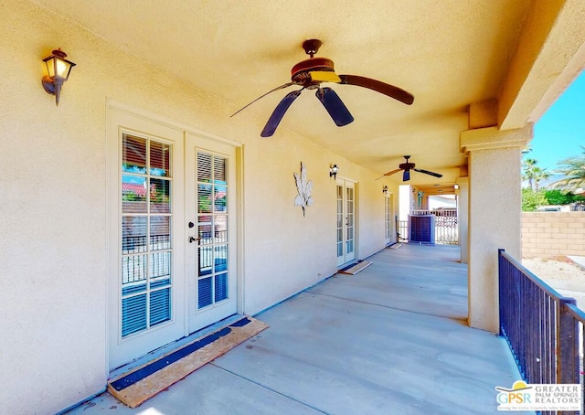 view of patio / terrace featuring ceiling fan and french doors