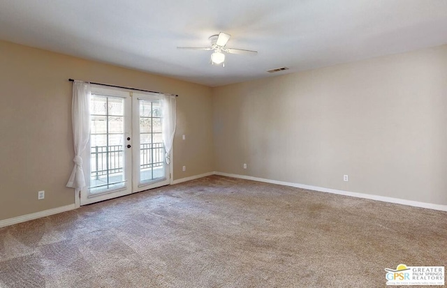 empty room featuring carpet, ceiling fan, and french doors