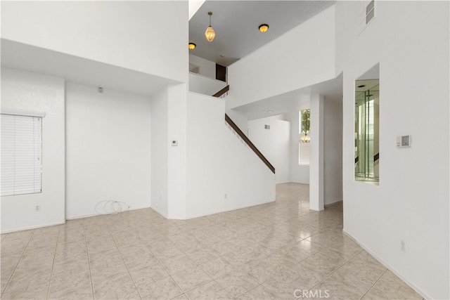 spare room featuring light tile patterned floors