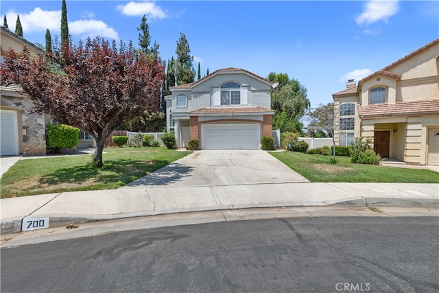 front of property with a front yard and a garage