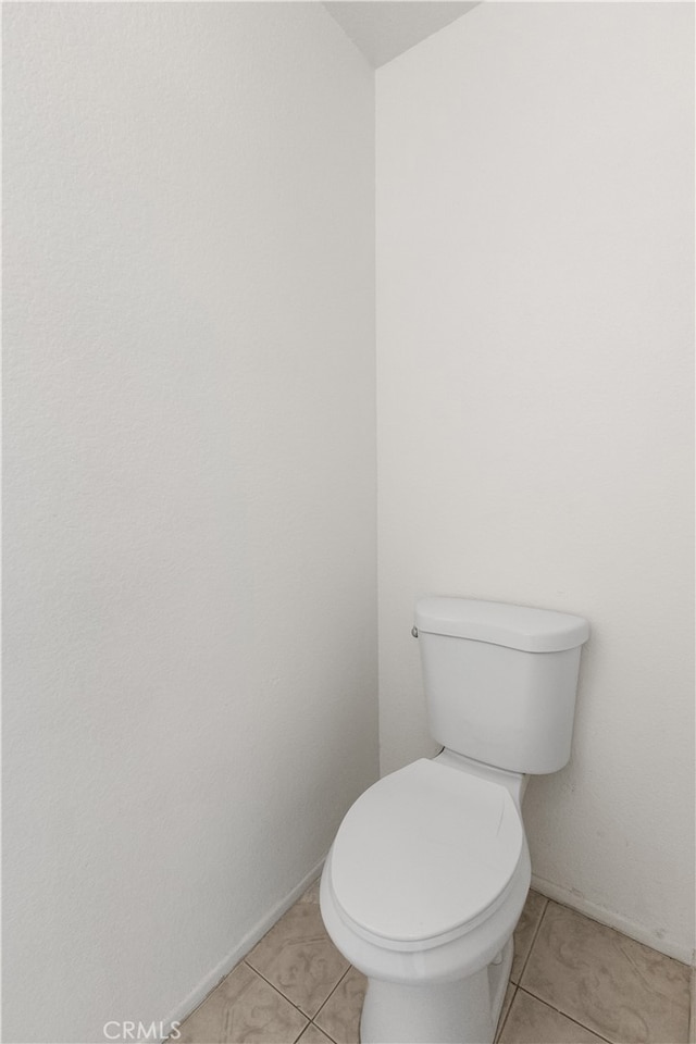 bathroom with tile patterned floors and toilet