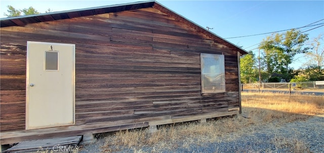 view of side of home with an outdoor structure